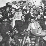 Villa having a party on the Presidential Chair in Mexico City with Zapata.