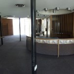 The old check-in desk at the old Marcy Branch library with recessed lighting.