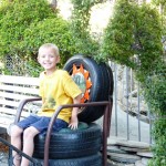 Wyatt tries out a chair made out of tires.