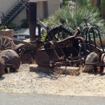 Found this rusting farm equipment decorated in front of a house.