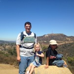 John, Madison, and AJ taking a break to look at the Hollywood sign.