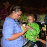 AJ and Denise inspecting a cacao pod.