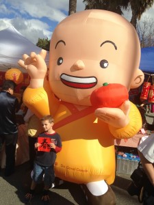 AJ posing with the Chinese character of Happy New Year.