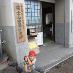 AJ waiting at the donation center at the 6th station.