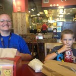 AJ and Denise enjoying pork belly sandwiches in Phoenix