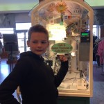 AJ got a souvenir coin than is the thickness of two pennies, just like the statue.